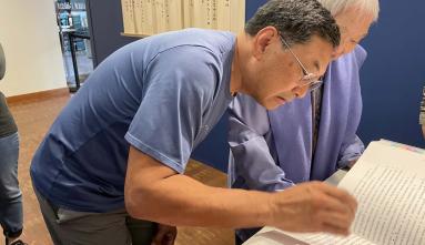 Hiroshi Kashiwagi placing hanko stamp with his mother Sadako.